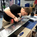 Carl pulling rivets on an aileron